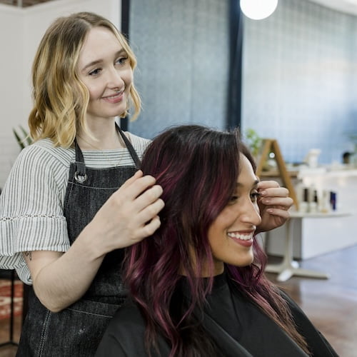 Expert hair styling in progress at a top-rated salon.